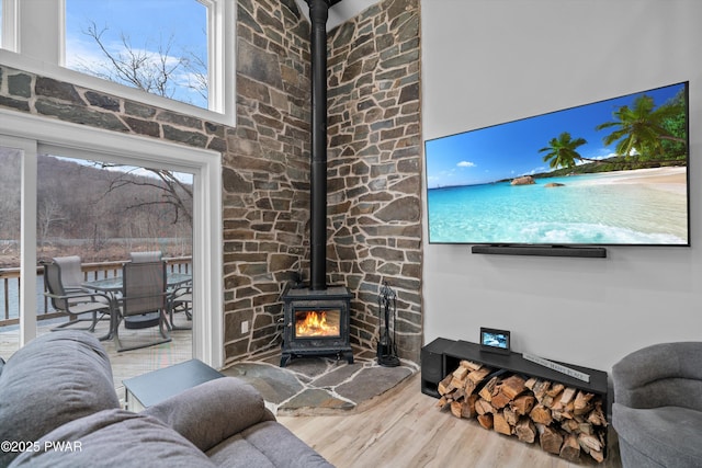 111 Riverbend Ln, Beach Lake, PA 18405 - living area featuring a wood stove and wood finished floors