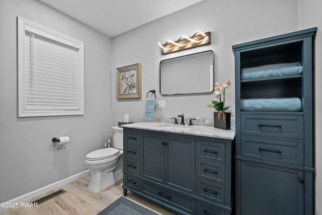 111 Riverbend Ln, Beach Lake, PA 18405 - bathroom featuring vanity, baseboards, toilet, visible vents, and wood finished floors