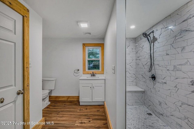 28 Holland Rd, Hawley, PA 18428 - full bath featuring tiled shower, vanity, and wood finished floors