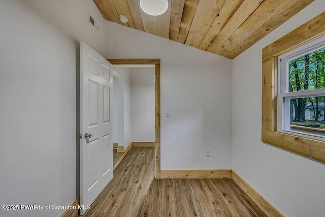 28 Holland Rd, Hawley, PA 18428 - unfurnished room featuring vaulted ceiling, wood finished floors, and a smoke detector
