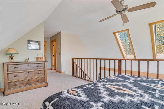 bedroom featuring ceiling fan, carpet flooring, and lofted ceiling