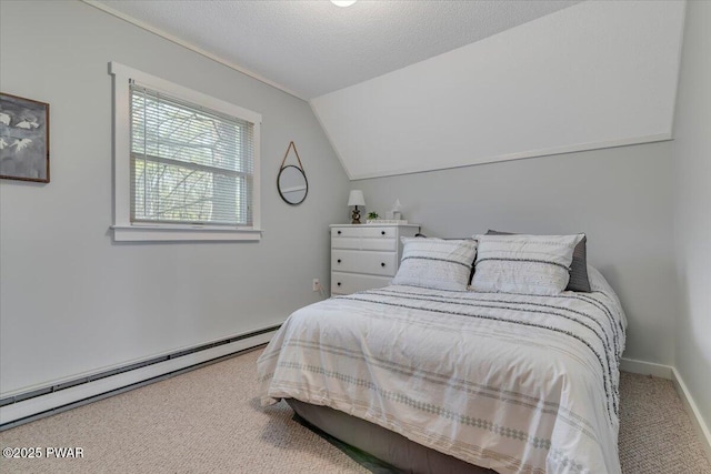 bedroom with carpet, baseboards, baseboard heating, and vaulted ceiling