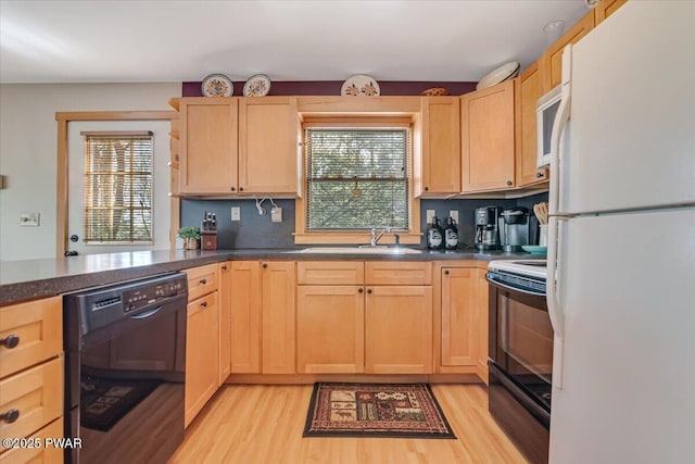 kitchen with white appliances and light brown cabinets