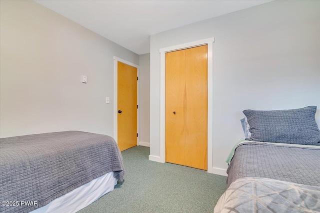bedroom featuring baseboards and carpet