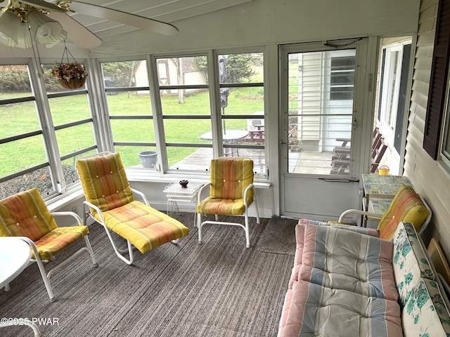 sunroom / solarium with a wealth of natural light and ceiling fan