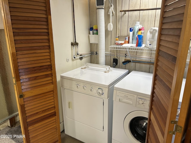 washroom featuring laundry area and washing machine and dryer