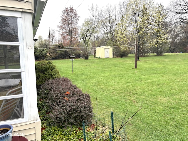 view of yard with an outdoor structure and a shed
