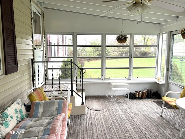sunroom featuring a healthy amount of sunlight and a ceiling fan