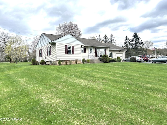 single story home featuring a front lawn and an attached garage