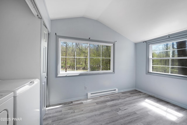 laundry area with independent washer and dryer, laundry area, wood finished floors, and a baseboard radiator