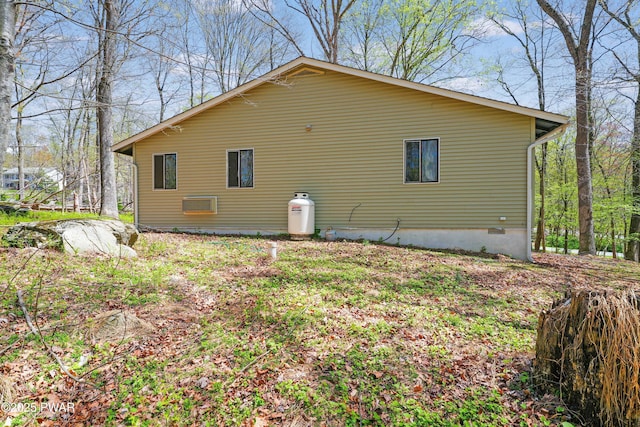 view of side of property with crawl space