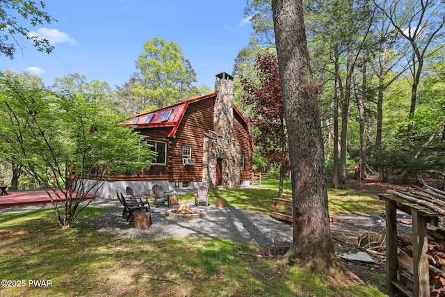 128 Timber Ln, Tafton, PA 18464 - view of green lawn featuring a fire pit and a wooden deck