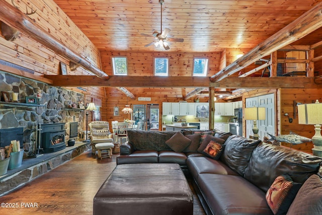 128 Timber Ln, Tafton, PA 18464 - living room featuring a wood stove, wooden walls, high vaulted ceiling, a ceiling fan, and hardwood / wood-style floors