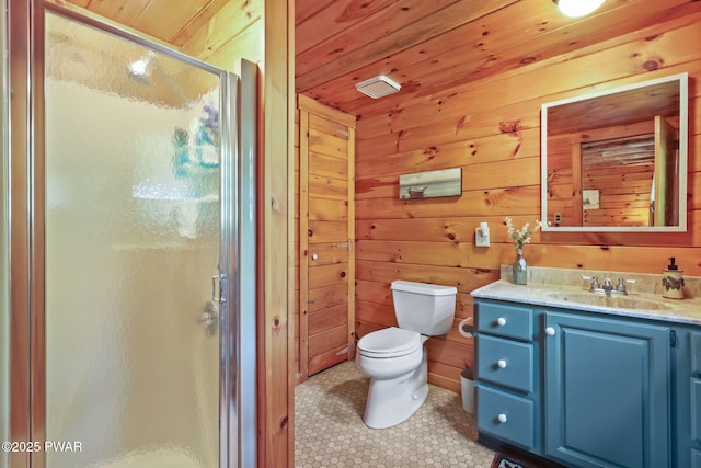128 Timber Ln, Tafton, PA 18464 - bathroom with a shower stall, wood walls, toilet, vanity, and tile patterned floors