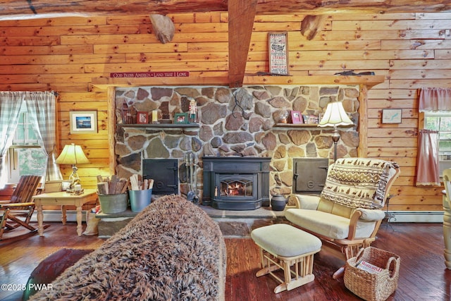 128 Timber Ln, Tafton, PA 18464 - living area featuring beam ceiling, wooden walls, hardwood / wood-style flooring, a wood stove, and baseboard heating