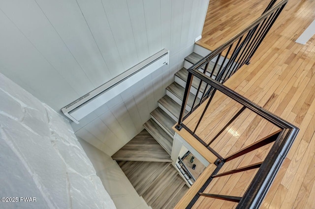 staircase with wood finished floors