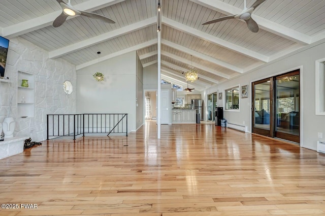 interior space with beamed ceiling, high vaulted ceiling, a ceiling fan, wood finished floors, and baseboard heating