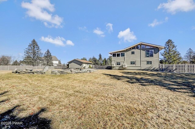 view of yard with a fenced backyard