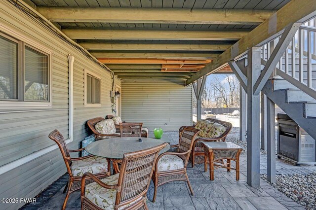 view of patio / terrace with outdoor dining area and stairs