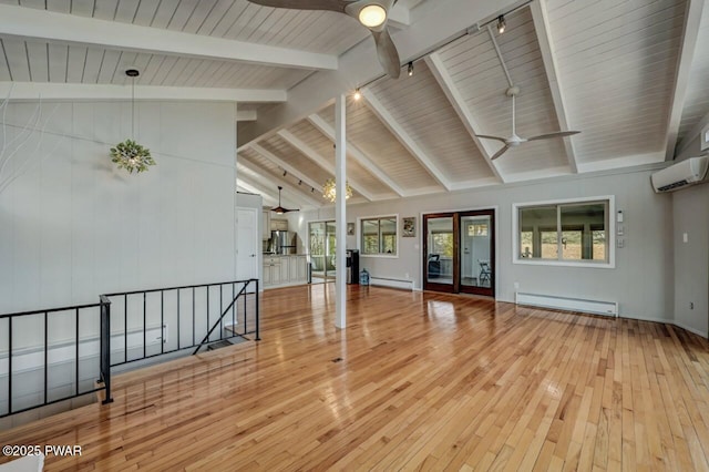 empty room with baseboard heating, a ceiling fan, a wall mounted AC, and light wood-style floors