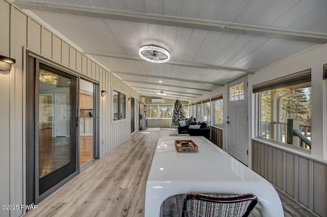 sunroom / solarium featuring wooden ceiling