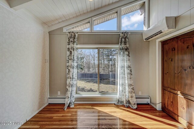 unfurnished dining area with an AC wall unit, wood-type flooring, wooden ceiling, lofted ceiling, and baseboard heating