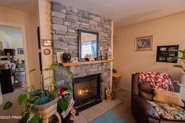 carpeted living area with a fireplace