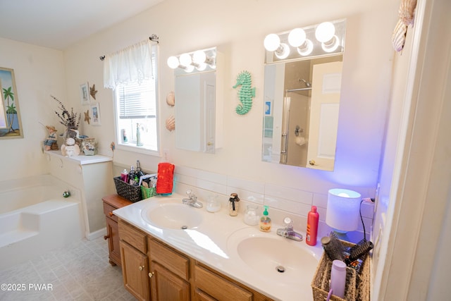 full bathroom featuring a garden tub, a sink, decorative backsplash, and double vanity