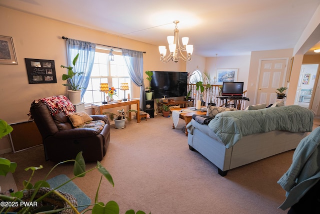 living area featuring carpet and a notable chandelier