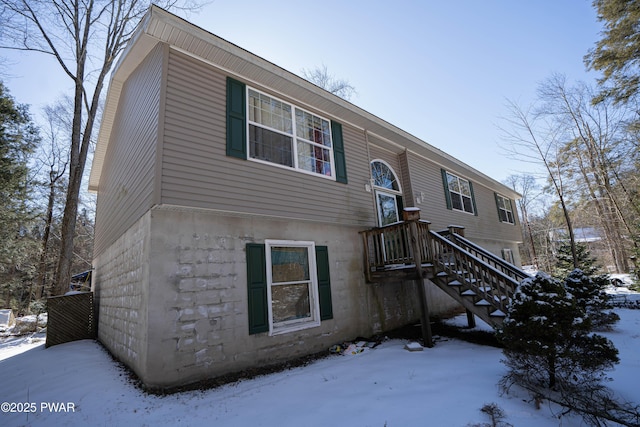 view of front of property featuring stairway