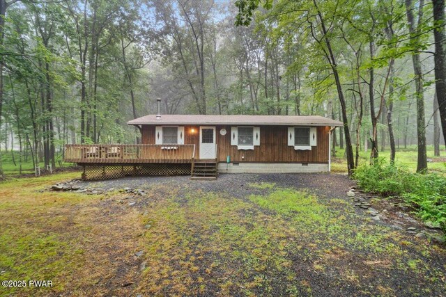 1081 Maple Lake Dr, Bushkill, PA 18324 - view of front of home with crawl space, a deck, and a wooded view