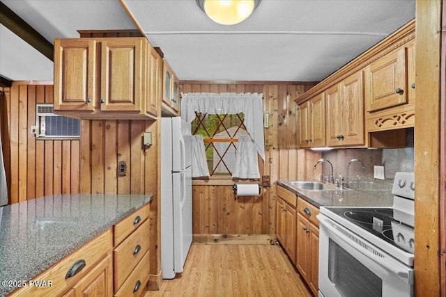 1081 Maple Lake Dr, Bushkill, PA 18324 - kitchen with white appliances, wooden walls, light wood-style floors, a wall unit AC, and brown cabinets