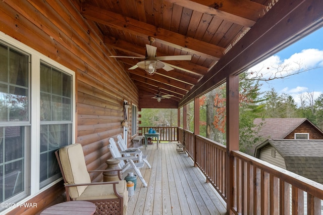 wooden terrace featuring ceiling fan and covered porch