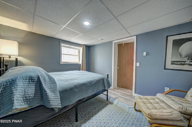 109 Pebble Rock Rd, Lackawaxen, PA 18435 - bedroom featuring baseboards, wood finished floors, and a drop ceiling