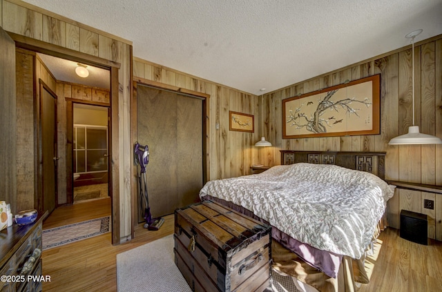 109 Pebble Rock Rd, Lackawaxen, PA 18435 - bedroom featuring a closet, a textured ceiling, and wood finished floors