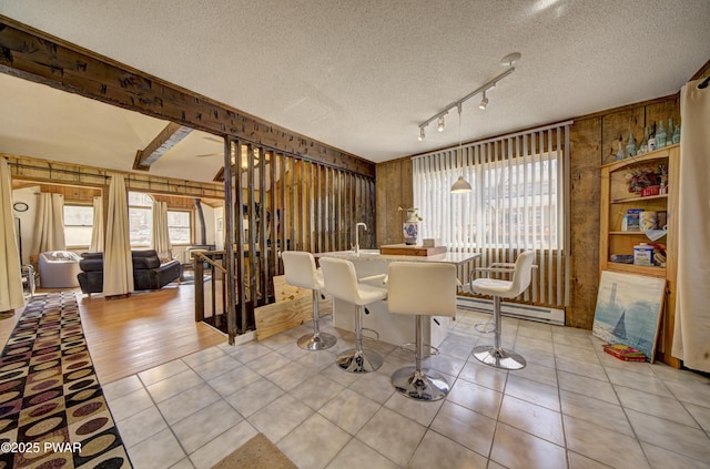 109 Pebble Rock Rd, Lackawaxen, PA 18435 - dining area featuring light tile patterned floors, a textured ceiling, and baseboard heating
