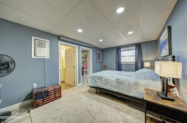 109 Pebble Rock Rd, Lackawaxen, PA 18435 - bedroom featuring ensuite bathroom, baseboards, wood finished floors, recessed lighting, and a drop ceiling