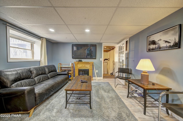109 Pebble Rock Rd, Lackawaxen, PA 18435 - living area with baseboards, wood finished floors, recessed lighting, and a paneled ceiling