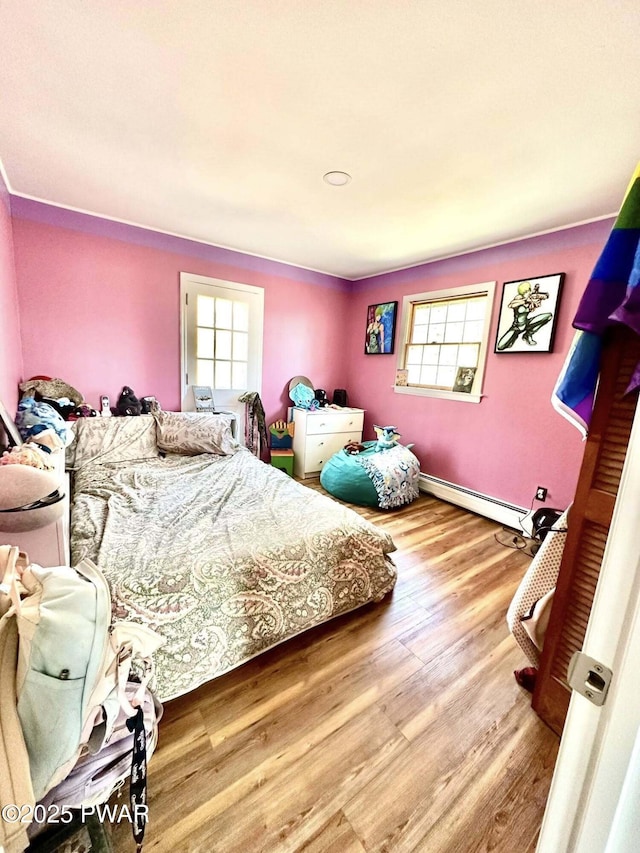 205 Waterview Dr, Lords Valley, PA 18428 - bedroom featuring baseboard heating and wood finished floors