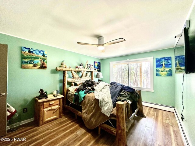 205 Waterview Dr, Lords Valley, PA 18428 - bedroom with a baseboard heating unit, wood finished floors, baseboards, and a ceiling fan