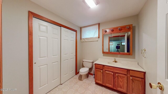 bathroom with toilet and vanity