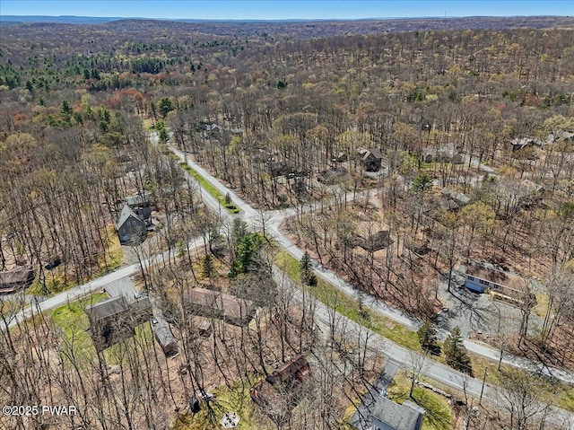 aerial view with a wooded view