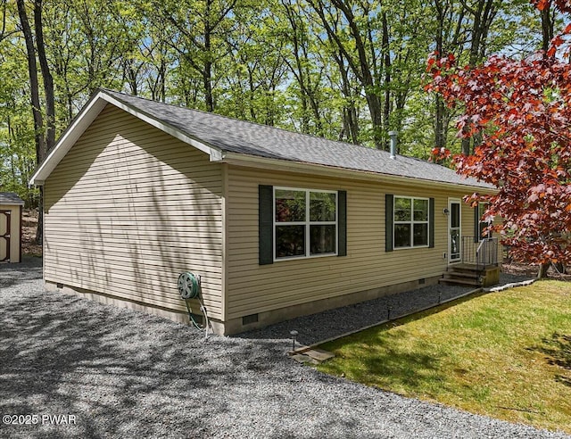 view of property exterior with crawl space and roof with shingles