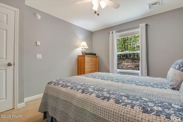 bedroom featuring carpet floors, baseboards, and a ceiling fan