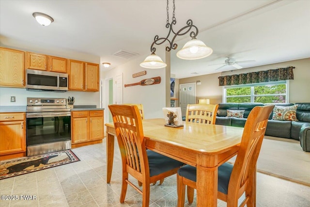 dining room featuring ceiling fan