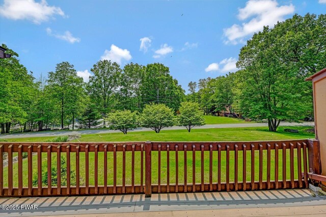 1107 Crest Cir, Lakeville, PA 18438 - wooden deck with a lawn and view of scattered trees