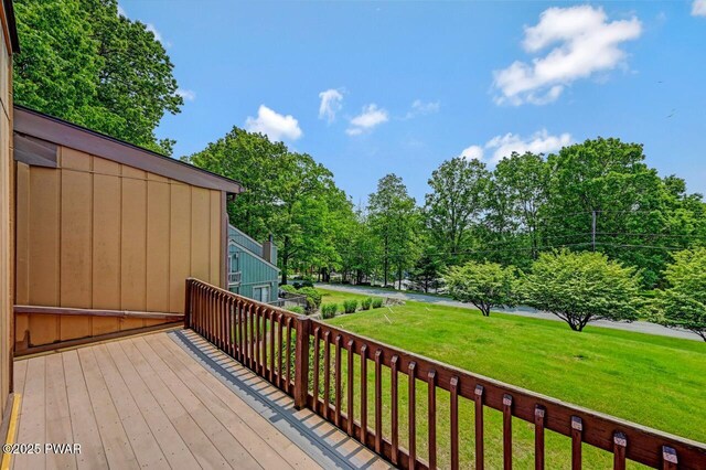 1107 Crest Cir, Lakeville, PA 18438 - wooden deck with a lawn and view of wooded area