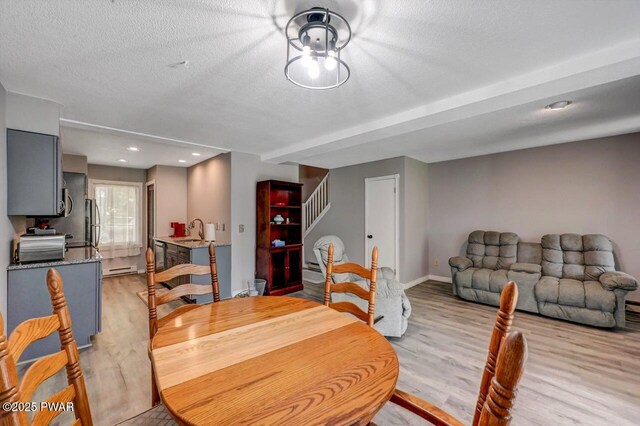1107 Crest Cir, Lakeville, PA 18438 - dining area with stairway, light wood-style flooring, baseboards, a textured ceiling, and recessed lighting