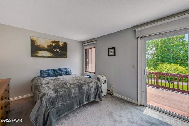 1107 Crest Cir, Lakeville, PA 18438 - carpeted bedroom with access to outside, baseboards, and a textured ceiling