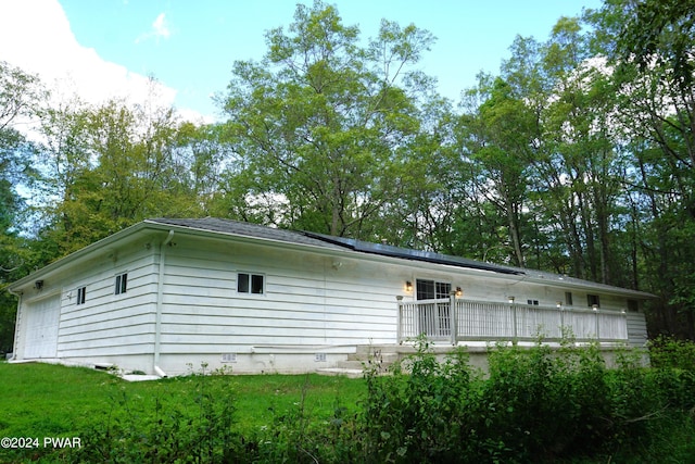 view of property exterior featuring solar panels